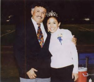 Photo courtesy of the 2003 Viewpointe. Torres celebrates with her father after having been crowned South's Homecoming Queen.