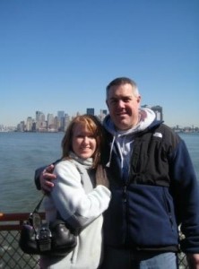 Jeff Nardone and wife DeEtte pose for a photograph near the water.